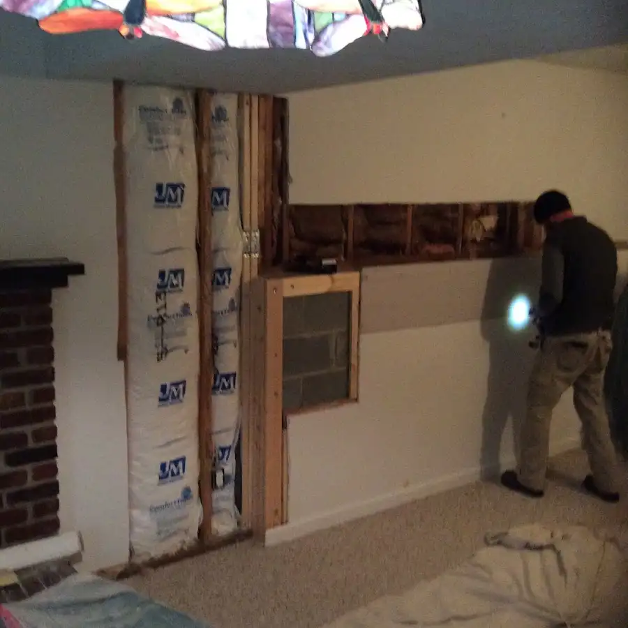 Restoration technician inspecting water damage in Mililani Mauka